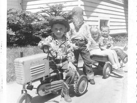 1955 May, Dave with tractor & kids.jpg